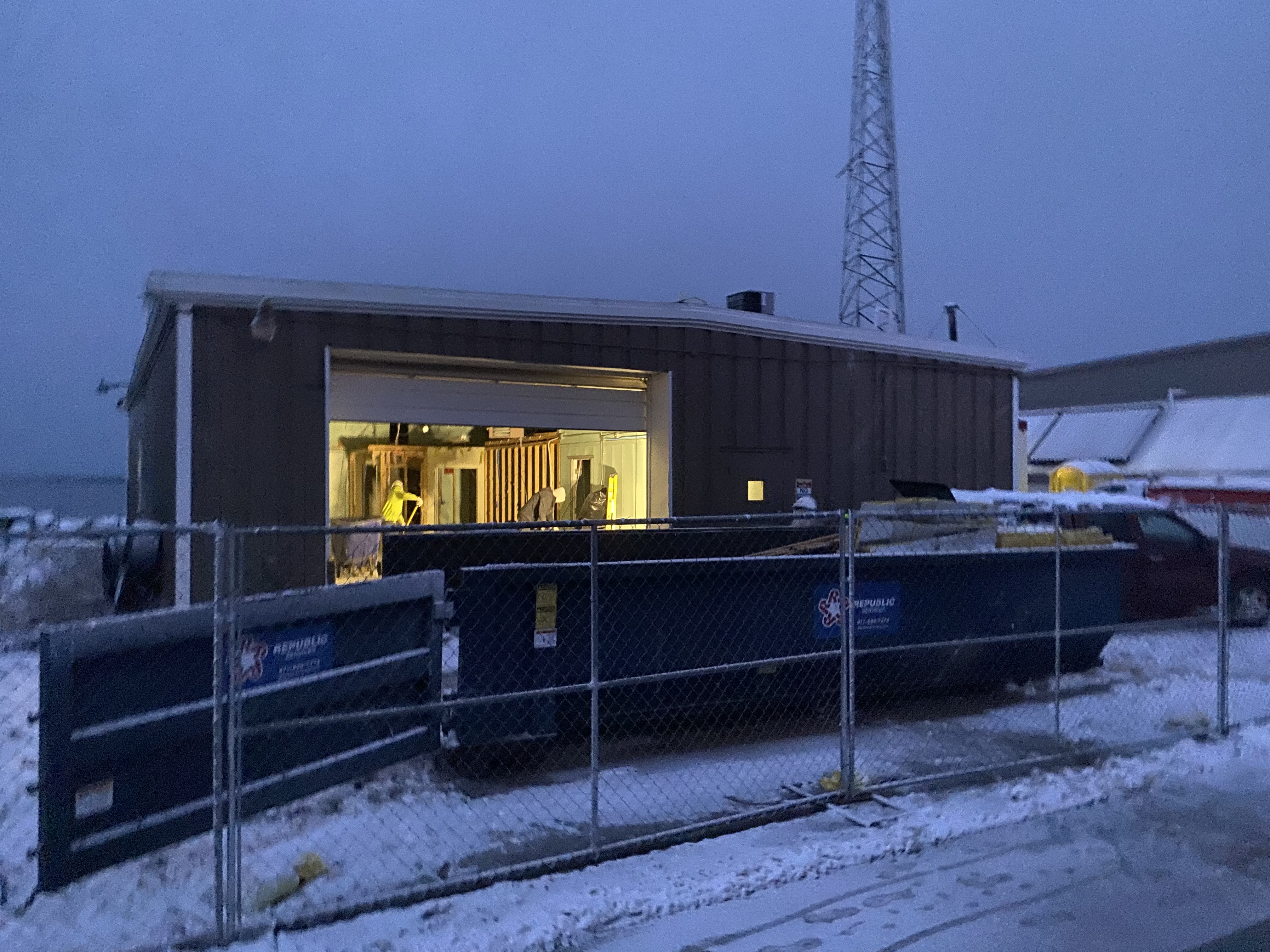 picture of buildig 3 at the Lake Michigan Field Station with the door open and construction workers inside