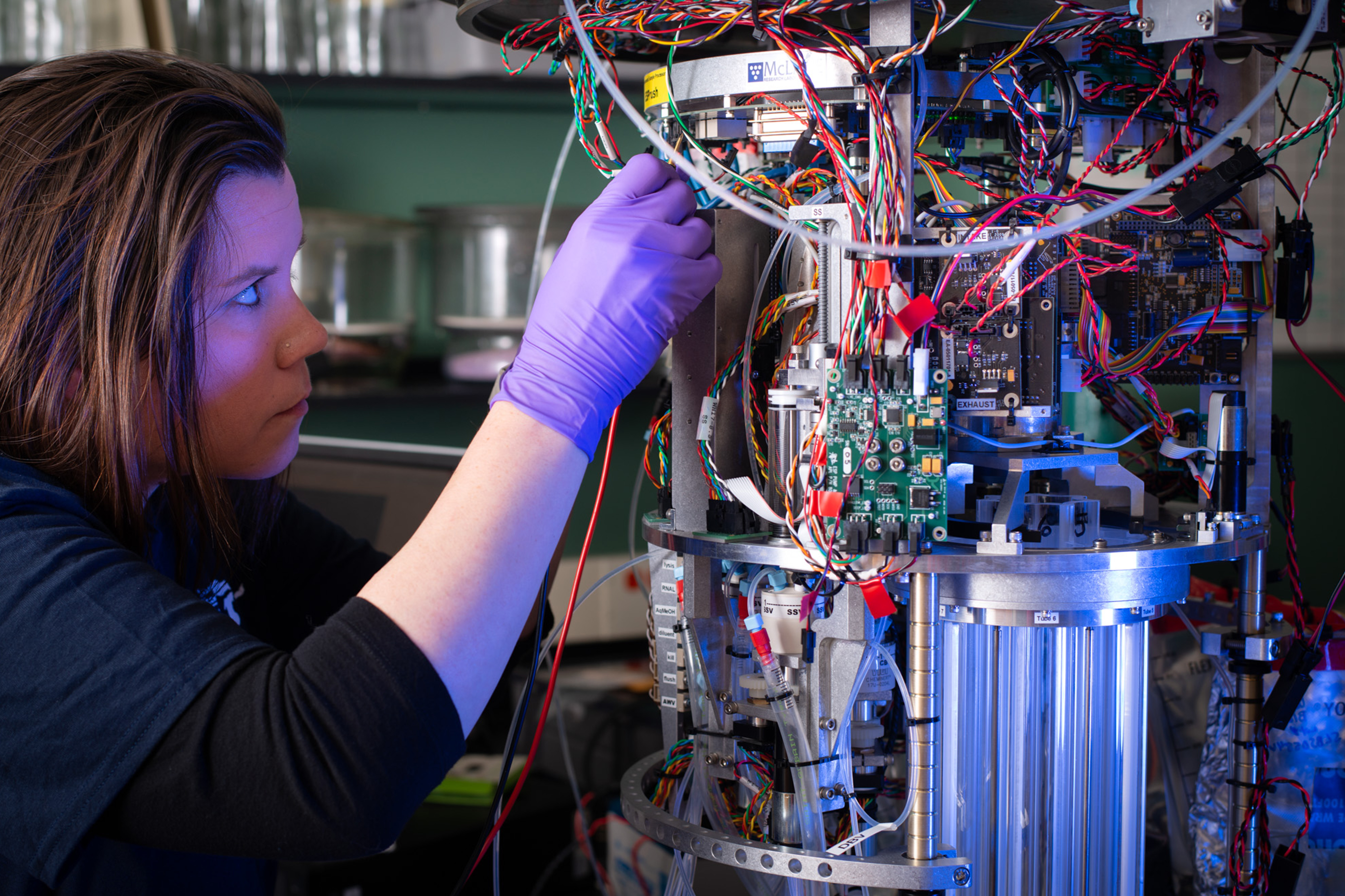 NOAA GLERL research associate Danna Palladino prepares an Environmental Sample Processor (ESP) for deployment. NOAA GLERL researchers use a variety of advanced technologies to study and monitor harmful algal blooms (HABs).